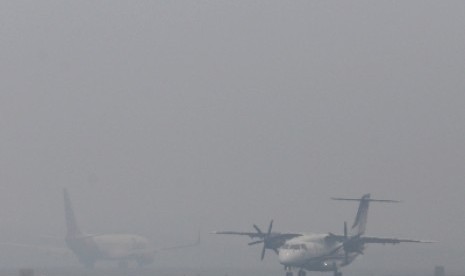 Kabut asap menyelimuti udara di Pekanbaru.