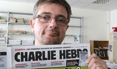 Pemimpin Redaksi Charlie Hebdo, Stephane Charbonnier menjadi korban serangan brutal.