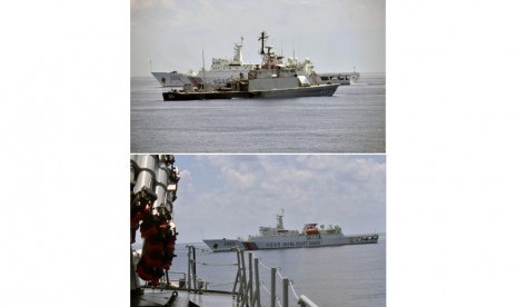 (Gambar atas) KRI Todak (631) berada di sebelah Kapal Coast Guard Cina 3303 saat mencoba menangkap kapal nelayan Han Tan Cou 19038 yang memasuki perairan Indonesia di Natuna, Kepulauan Riau, Jumat (17/6). 