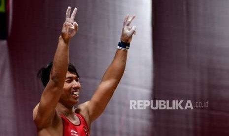  Ekpresi Lifter Indonesia  Deni   usai melakukan angkatan saat bertanding di cabang angkat besi putra nomor  69  Kg Asian Games 2018 di Hall A Kemayoran, Jakarta, Rabu (22/8).