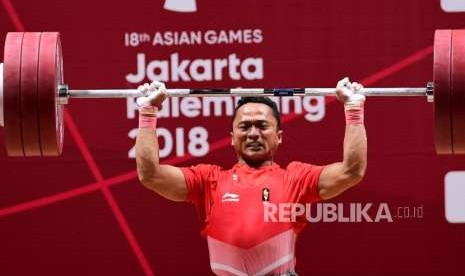 Lifter Indonesia Triyatno (ilustrasi). Triyatno berusaha menambah poin Olimpiade dalam kejuaraan di Iran, bulan depan.