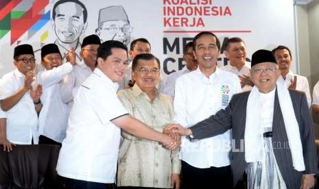 Incumbent President Joko Widodo (second right) hold hands with Vice Presidential Candidate KH Maruf Amin (right), Vice President Jusuf Kalla (second left) as chief of Steering Committe of National Campaign Team, and businessman Erick Thohir as chief of his National Campaign Team in Jakarta, Friday (Sept 7).