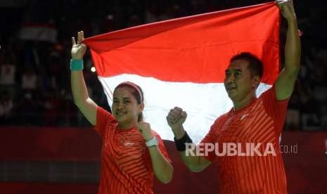 Pebulu tangkis Indonesia Leani Ratri Oktila dan Hary Susanto (ilustrasi). Hary/Ratri meraih emas pada Paralimpiade 2020.