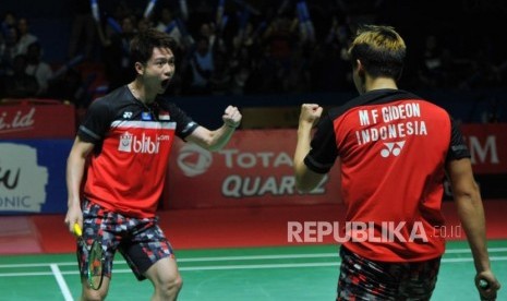 Ekspresi pasangan ganda putra Indonesia  Marcus Fernaldi Gideon-Kevin Sanjaya Sukamuljo seusai mengalahkan ganda putra Cina Li Jun Hui-Liu Yu Chen pada babak semifinal turnamen Blibli Indonesia Open 2019 di Istora Senayan, Jakarta, Sabtu (20/7).