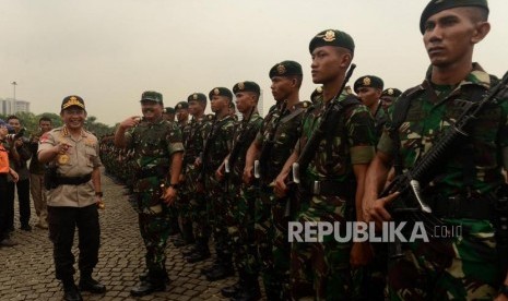 TNI Chief Marshal Hadi Tjahjanto and National Police Chief General Tito Karnavian lead  roll call ceremony on the preparations for Christmas, New Year's Eve 2019, and the presidential and legislative elections in Monas, Jakarta, Friday (Nov 30).