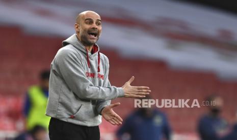 Reaksi pelatih kepala Manchester City Pep Guardiola selama pertandingan sepak bola Liga Utama Inggris antara Arsenal dan Manchester City di Stadion Emirates di London, Inggris, Minggu, 21 Februari 2021. 