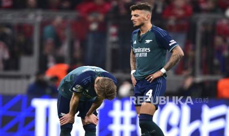 Arsenal tampak kecewa saat dikalahkan Munchen. 