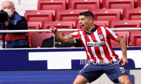  Ekspresi penyerang Atletico Madrid Luis Suarez usai menjebol gawang Real Madrid.