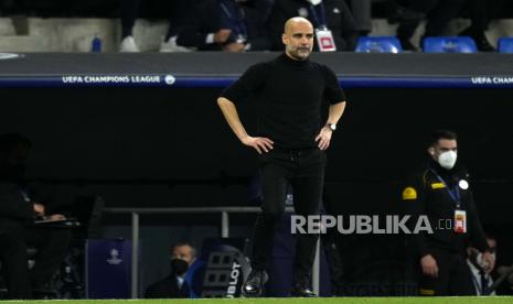  Reaksi pelatih kepala Manchester City Pep Guardiola selama pertandingan sepak bola leg kedua semifinal Liga Champions antara Real Madrid dan Manchester City di stadion Santiago Bernabeu di Madrid, Spanyol,  Kamis (5/5/2022) dini hari WIB.