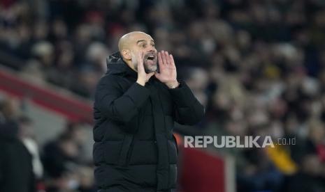 Pelatih kepala Manchester City, Pep Guardiola,. berteriak selama pertandingan sepak bola Liga Premier Inggris.