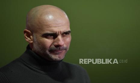  Reaksi manajer Manchester City Pep Guardiola saat wawancara setelah pertandingan sepak bola putaran keempat Piala FA Inggris antara Cheltenham Town dan Manchester City di Cheltenham, Inggris, 23 Januari 2021.