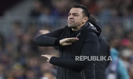 Pelatih kepala Barcelona Xavi Hernandez bereaksi pada pertandingan sepak bola La Liga Spanyol antara Barcelona dan Real Madrid di stadion Camp Nou di Barcelona, ??Spanyol, Senin (20/3/2023) dini hari WIB. 