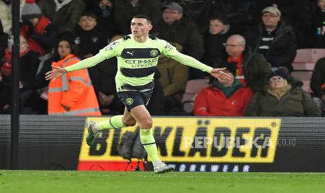 Pemain Manchester City Phil Foden merayakan golnya ke gawang Bournemouth pada pertandingan sepak bola Liga Utama Inggris antara AFC Bournemouth vs Manchester City di Bournemouth, Inggris, Ahad (26/2/2023) dini hari WIB.