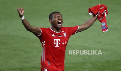  David Alaba dari Bayern merayakan setelah memenangkan pertandingan final Liga Champions antara Paris Saint-Germain dan Bayern Munich di stadion Luz di Lisbon, Portugal, Minggu, 23 Agustus 2020. 