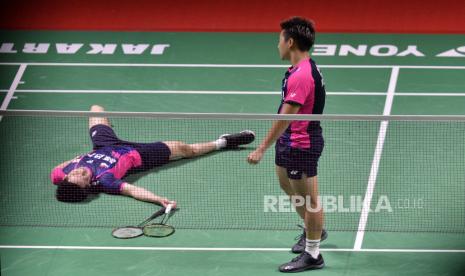 Ekspresi pebulu tangkis ganda putra Indonesia Marcus Gideon/Kevin Sanjaya.