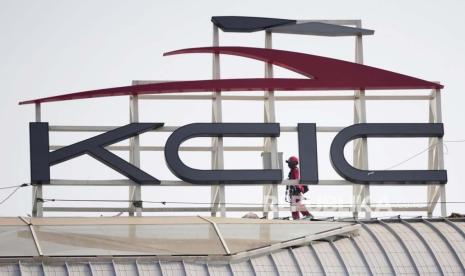 A worker walks past the logo of PT Kereta Cepat Indonesia-China (PT KCIC), a joint venture between an Indonesian consortium of four state-owned companies and China Railway International Co. Ltd, at the construction site of Halim Station ahead of an operational test run of the Jakarta-Bandung high-speed train in September, in Jakarta, Indonesia, Saturday, Aug. 12, 2023. The first high-speed rail service in Southeast Asia, which is part of China