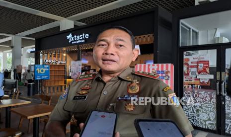 Kepala Satpol PP DKI Jakarta, Arifin. Satpol PP membantah kecolongan dengan adanya pengibaran bendera LGBT di Monas.