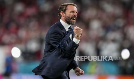 Manajer Inggris Gareth Southgate melakukan selebrasi usai memenangkan pertandingan semifinal kejuaraan sepak bola Euro 2020 melawan Denmark di stadion Wembley di London, Rabu, 7 Juli 2021. 