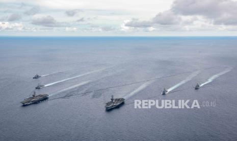 A leaflet photo provided by the U.S. Office of Naval Information shows aircraft carriers USS Ronald Reagan (CVN 76) and USS Nimitz (CVN 68) and their strike groups (CSGs) steam in formation during exercises in the South China Sea, July 06, 2020. On July 13, 2020, U.S. Secretary of State Mike Pompeo officially rejected most of China's claims over the South China Sea.