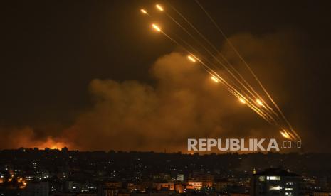 Rockets are fired toward Israel from the Gaza Strip, Sunday, Oct. 8, 2023. The militant Hamas rulers of the Gaza Strip carried out an unprecedented, multi-front attack on Israel at daybreak Saturday, firing thousands of rockets as dozens of Hamas fighters infiltrated the heavily fortified border in several locations, killing hundreds and taking captives. Palestinian health officials reported scores of deaths from Israeli airstrikes in Gaza. 