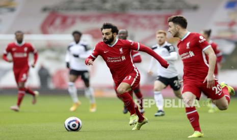 Mohamed Salah (C) of Liverpool in action during the English Premier League soccer match between Liverpool FC and Fulham FC in Liverpool, Britain, 07 March 2021.  