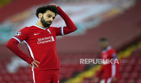 Mohamed Salah dari Liverpool bereaksi selama perempat final Liga Champions UEFA, pertandingan sepak bola leg kedua antara Liverpool FC dan Real Madrid di Liverpool, Inggris, 14 April 2021.