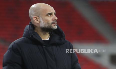 Pelatih kepala Manchester City Pep Guardiola jelang laga leg kedua babak 16 besar Liga Champions antara Manchester City dan Borussia Moenchengladbach di Puskas Arena di Budapest, Hongaria, Selasa, 16 Maret 2021. 