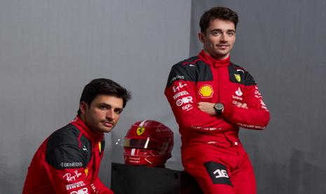 A handout photo made available by the Scuderia Ferrari press office shows drivers Charles Leclerc (R) and Carlos Sainz Jr. (L) posing during the presentation of the team