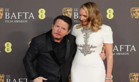 Aktor Michael J Fox dan istrinya Tracy Pollan menghadiri 2024 EE BAFTA Film Awards di London, Inggris, 18 Februari 2024. Acara ini dihelat oleh British Academy of Film and Television Arts (BAFTA).