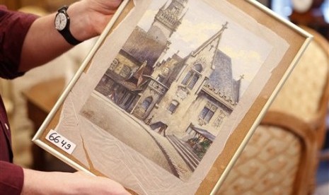 A 100 year old picture titled “The Old City Hall” that - as the auction house said - was painted by Adolf Hitler is displayed in an auction house in Nuremberg, Germany. 