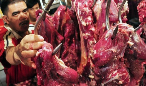 A bucther arrange some beef stock at a market stall in Jakarta (illustration)  