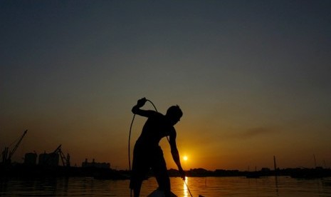 A fisherman in Muara Baru, Jakarta (illustration)