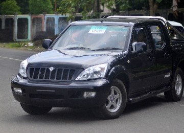 A high rank official of Karanganyar is testing a student made car in Solo, recently.  