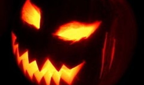 A jack-o'-lantern, one of the symbols of Halloween representing the souls of the dead. (Illustration)