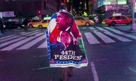 A man exits after watching U.S. President Barack Obama's acceptance speech broadcast live in Times Square following his re-election in New York November 7, 2012.  