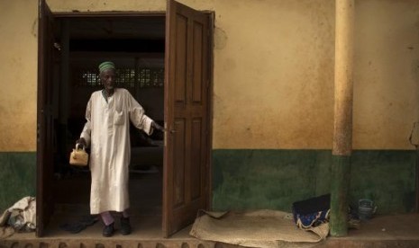 A man walks out of a mosque near Kilometre 12 (PK12) where internally displaced Muslims are stranded due to the ongoing sectarian violence in Bangui, March 6, 2014.