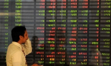 A man watches shares in Jakarta Stock Exchange. (illustration) 