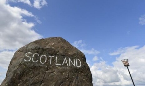 A marker stone is seen at Carter Bar in the Scottish Borders August 22, 2013.