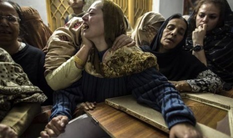 A mother mourns her son Mohammed Ali Khan, 15, a student who was killed during an attack by Taliban gunmen on the Army Public School, at her house in Peshawar December 16, 2014. 