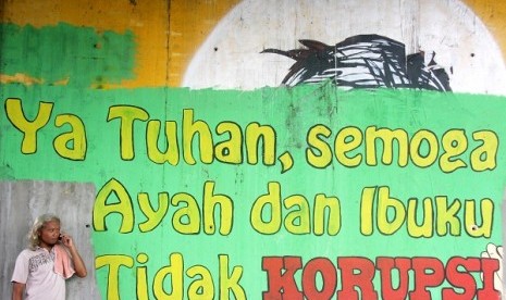 A mural with anti-corruption message is painted on the wall under the bridge in Jakarta. (illustration)