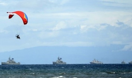 A paramotor athlete maneuvers during the last preparation of Sail Raja Ampat in West Papua on Friday. 