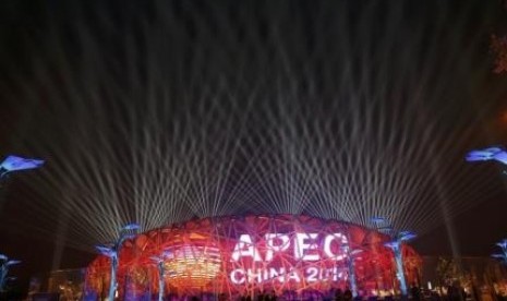 A screen displays the APEC logo on the National Stadium, or the 