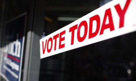 A sign hangs in the window of a shop during the U.S. presidential election in South Boston, Massachusetts, November 6, 2012.  