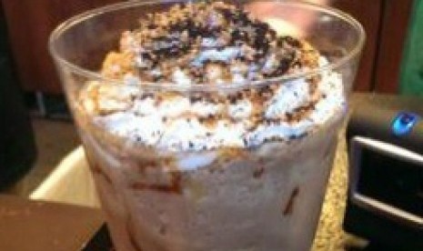 A Starbucks frappuccino, containing 60 shots of espresso and topped with whipped cream, which took Andrew Chifari of Texas five days to consume is seen in Dallas, Texas in this May 24, 2014.