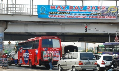 A streer banner of May Day 2012 is on display in Cempaka Putih, Jakarta.     