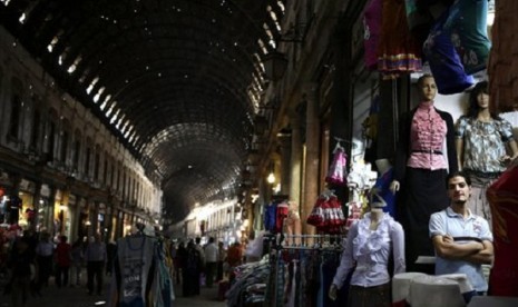 A Syrian shopkeeper waits for customers at the popular Hamidiyeh old market, in Damascus, August 22, 2013. The veneer of normalcy is thin in Damascus, the stronghold of President Bashar Assad's rule, after more than 2 1/2 years of bloodshed. 