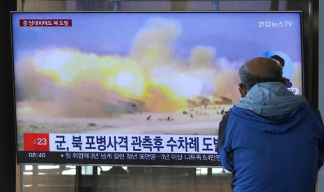 A TV screen shows a file image of North Korea