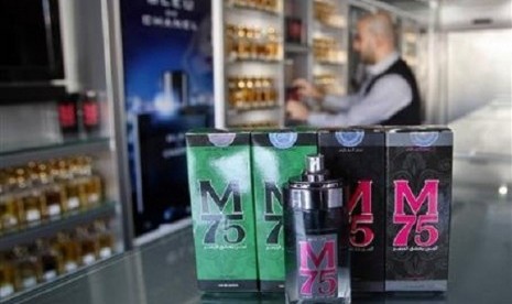 A vendor displays perfume bottles called M75 at his shop in Gaza City December 12, 2012. The Gaza vendor said the new perfume symbolises the name of the home-made M75 rocket.   