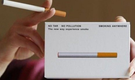 A woman displays a package of E-cigarette, an electronic substitute in the form of a rod, slightly longer than a normal cigarette, in Bordeaux, southwestern France, in this 2008  picture.