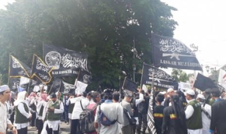 Aksi solidaritas untuk Muslim Uighur yang digelar di Titik Nol  Kilometer Yogyakarta, Jumat (21/12).